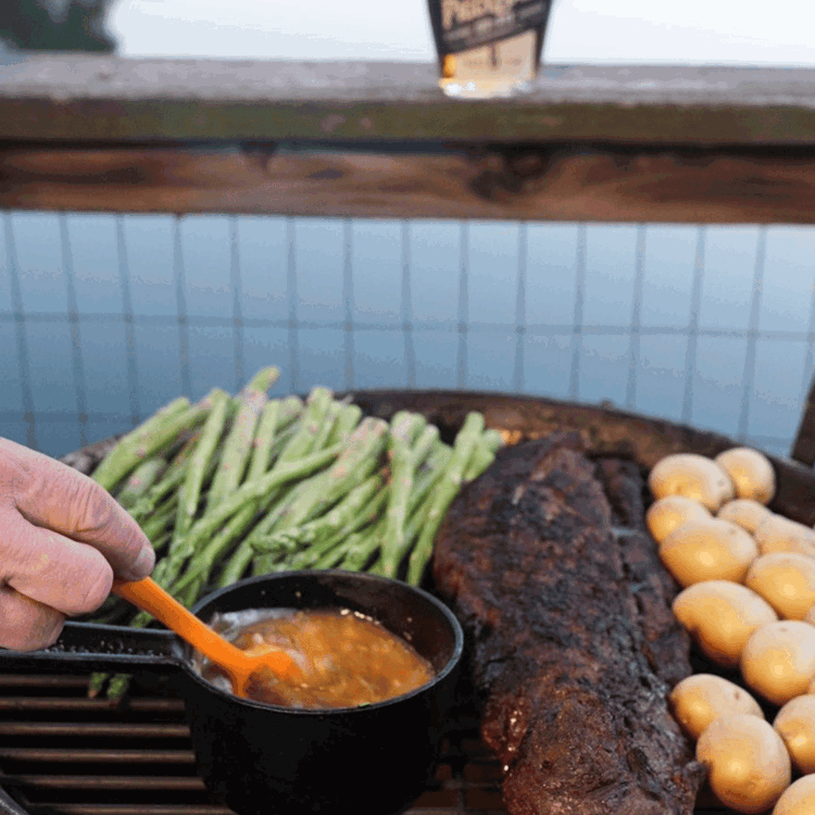 Image of Finish cooking the elk by moving the tenderloin to indirect heat and continue cooking it until the internal temperature reaches 120°F for medium-rare (or your desired doneness). Baste with the tarragon whiskey butter every few minutes.