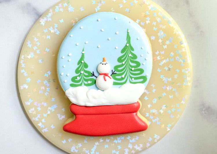 Image of Admire your beautiful snow globe cookie design! 