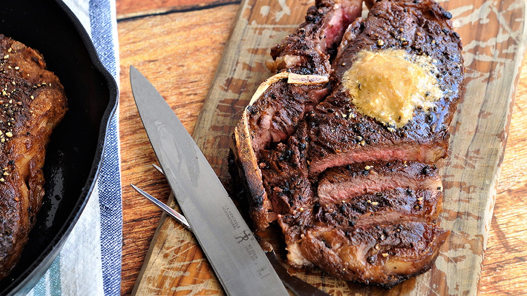 Image of Black Pepper-Crusted Bone-In NY Strip with Smoked Bleu Cheese Butter