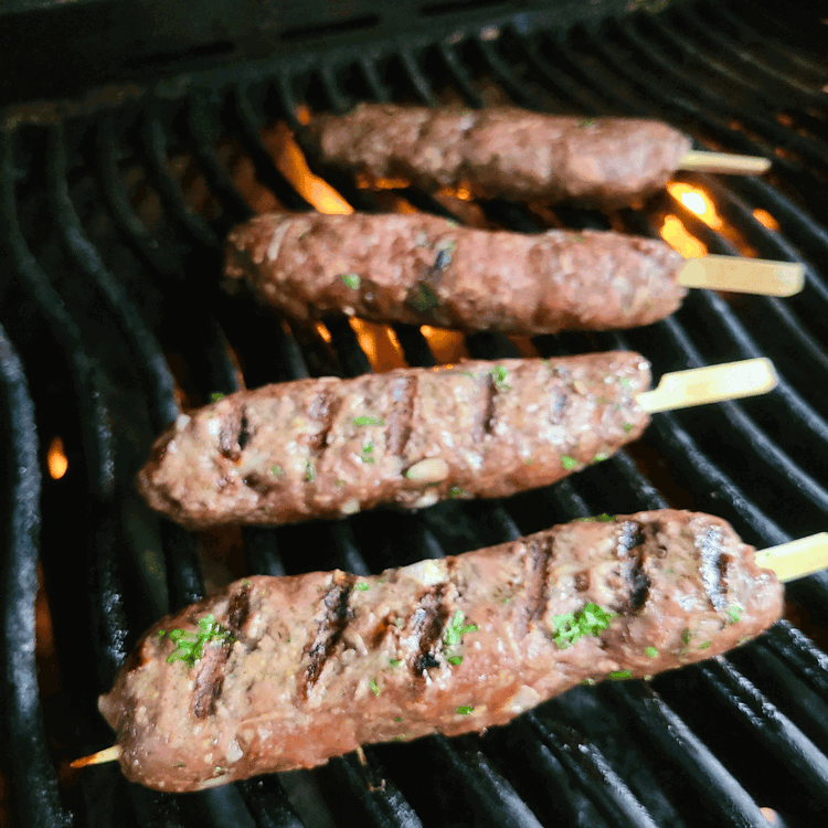 Image of Gently flip the skewers only when the meat pulls away from the grates easily and grill marks have formed on the bottom. Grill on the other side for an additional 3-4 minutes until cooked through.