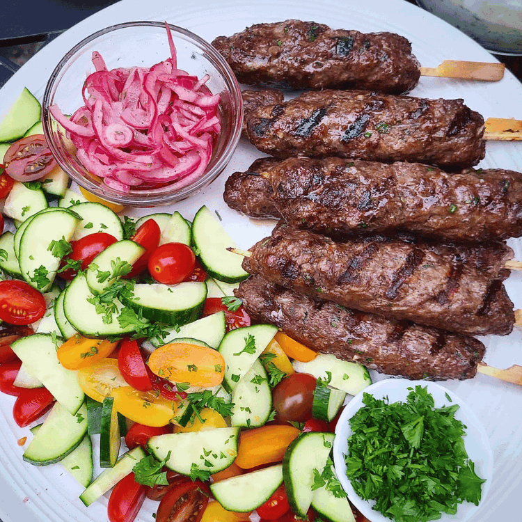 Image of Transfer the kabobs to a plate and let them rest for about five minutes before serving. Be sure to pour any accumulated juices over the kabobs before serving with your favorite sides. 
