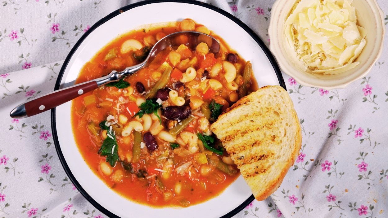 Original Italian minestrone, a hearty stew of fresh vegetables, white beans and pasta. This classic Italian vegetable soup is healthy, flavoursome and perfect for any season. Made with courgette, carrot, potato and tomato, and served with parmesan and ciabatta, it's the ideal recipe for a light yet satisfying meal.