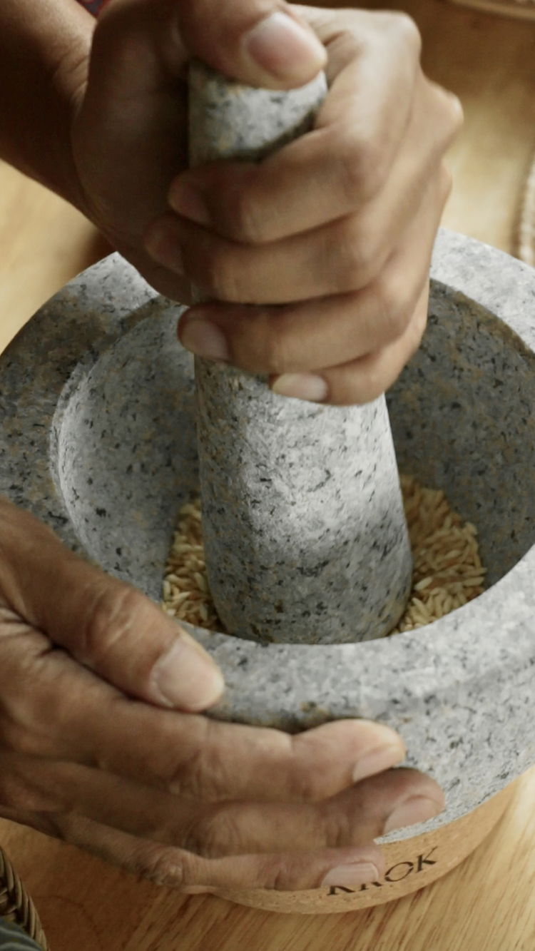 Image of Transfer the toasted rice to your mortar and pestle. 