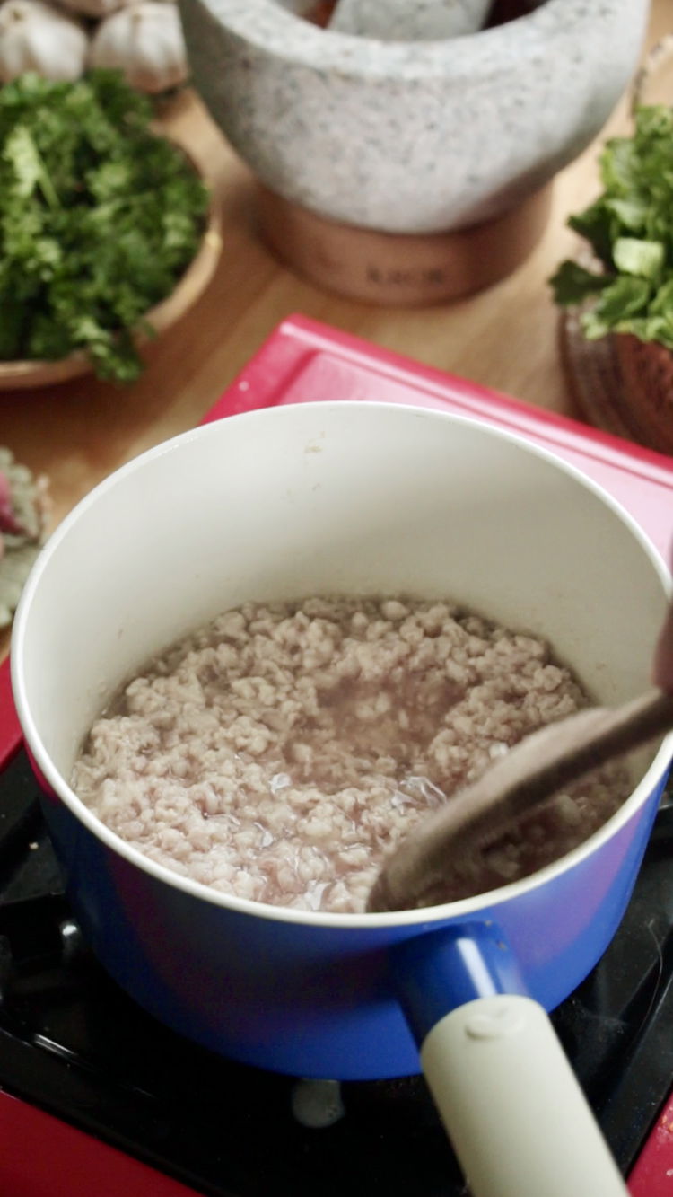 Image of In a large pan, heat 1/2 cup of water over...