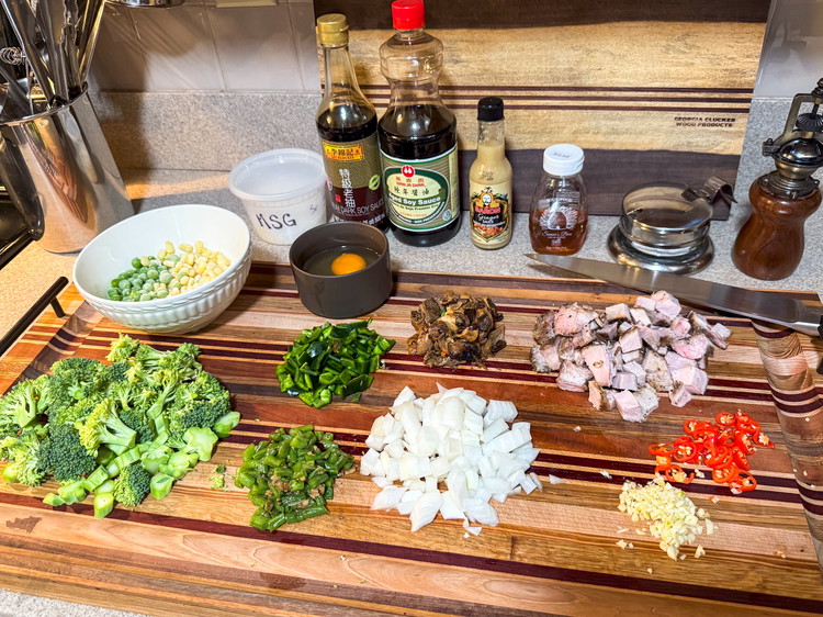 Image of Prep all of your veggies by cutting into bite size pieces as needed. I like to use a sheet pan as they are coming off of the cutting board. I generally organize them from the things that will go in...
