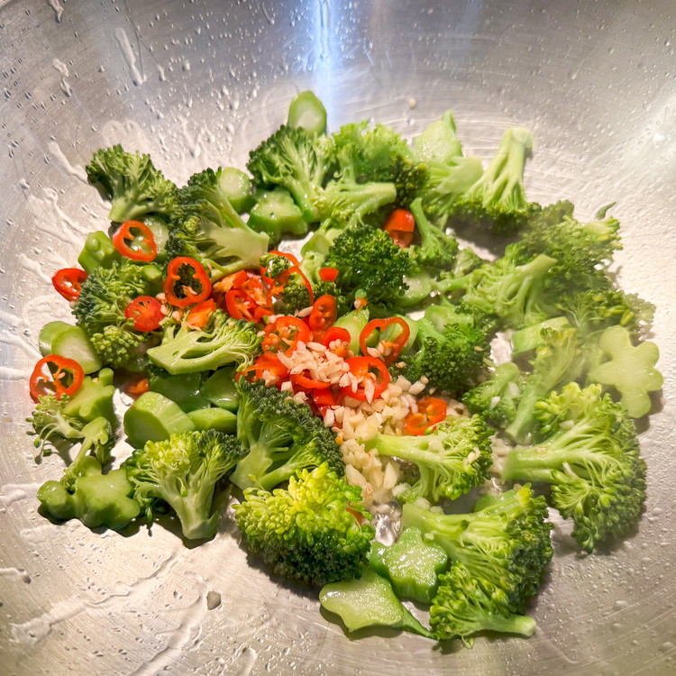 Image of Garlic, Ginger, Biquinho Peppers. Saute an additional 1 minute.  (careful if you’re using other hot peppers. If you don’t have good ventilation, save the hot hot peppers for later or you will pepper gas your guests and family).