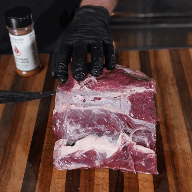 Image of Prep Roast: Remove silver skin and excess fat from the rib roast. 