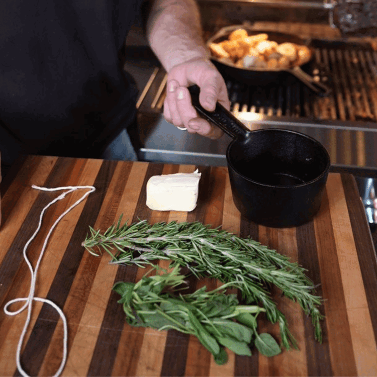 Image of Baste: Mix melted butter with rosemary and sage. 