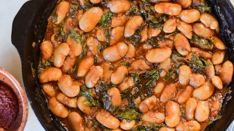 Image of Braised White Beans with Greens and Harissa