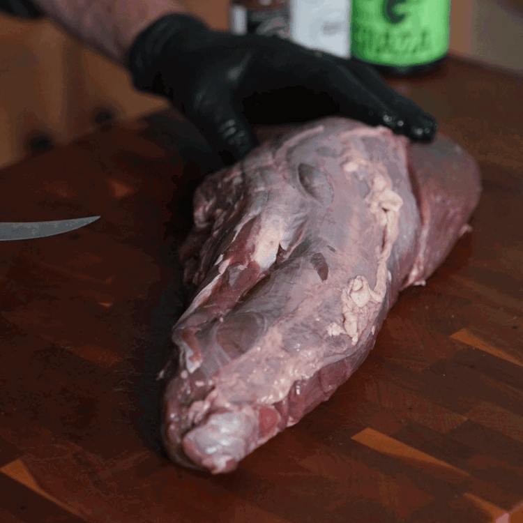 Image of Prep the meat by removing any silver skin and then pat the tenderloin dry with a paper towel.