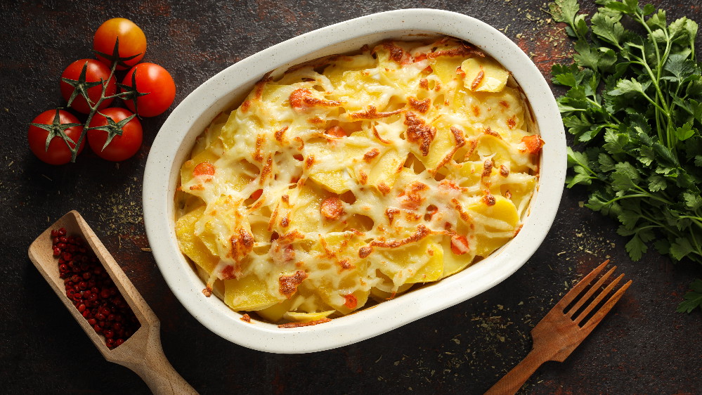 Image of Cremiges Kartoffelgratin mit Rahmsauce und Bergkäse