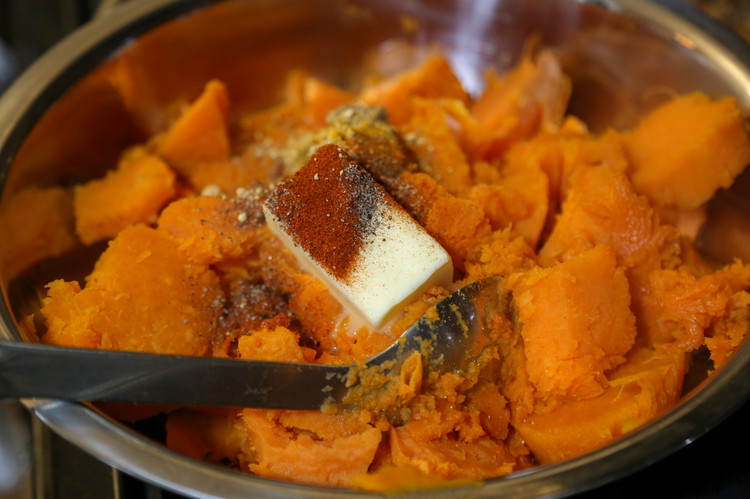 Image of Cut butter into cubes (I should have done this) and add to the sweet potatoes along with the salt and spices and egg yolk. Mash everything together really well and transfer to your glass casserole dish. If it’s small you...
