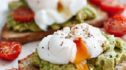 Image of Avocado Toast with Poached Eggs and Cherry Tomatoes