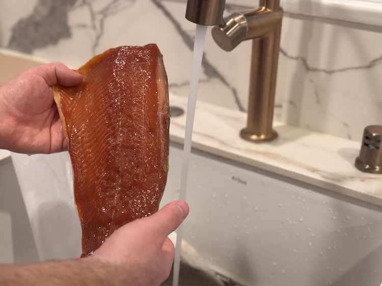 Image of After 48 hours, remove the steelhead from the cure and clean thoroughly using water and napkins.