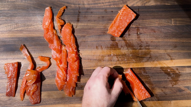 Image of Use a sashimi knife to slice the steelhead thinly, cutting against the grain for the best texture. 