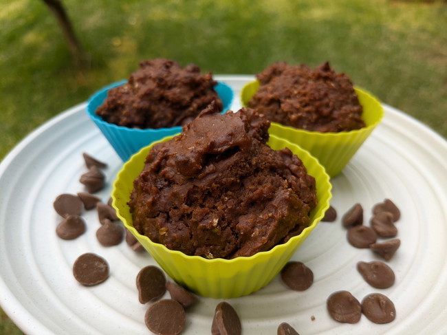 Chocolate muffins with Orange Veg Blocks, on a white plate