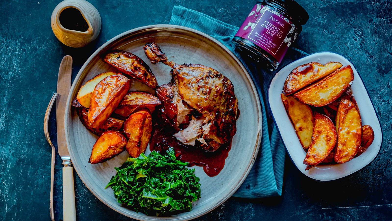 Image of Duck legs with Cherry Amaretto sauce and goose fat wedges