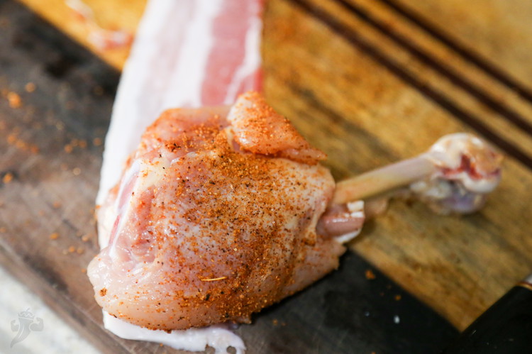 Image of Season the chicken pop with some Ghost Pepper BBQ rub and lay it on a piece of bacon. Wrap the bacon around the leg, starting from the fat end and ending by tucking the last bit of bacon under the...