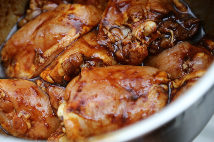 Image of Remove the skin from the chicken thighs, trim any fat you want to and add to the large bowl with the 2/3rds marinade in it. Marinate for 1 hour. Once the chicken is on the grill discard any remaining raw...