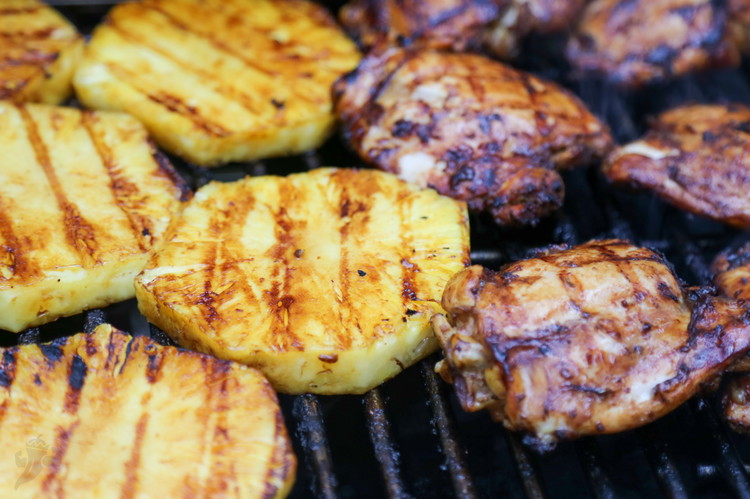 Image of Peel and slice your pineapple into rounds leaving the core intact for grillable rounds, about 3/4 inch thick. Set aside.