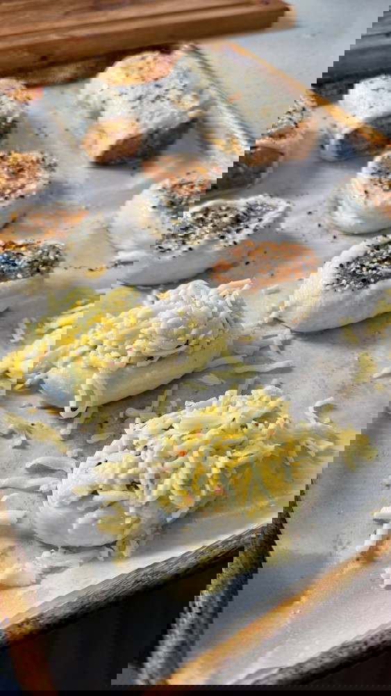 Image of Brush pastry with egg wash, then sprinkle sesame seeds over the top. If you don’t like crispy cheese, add the grated cheese during the cook, when the pastry just starts to brown.