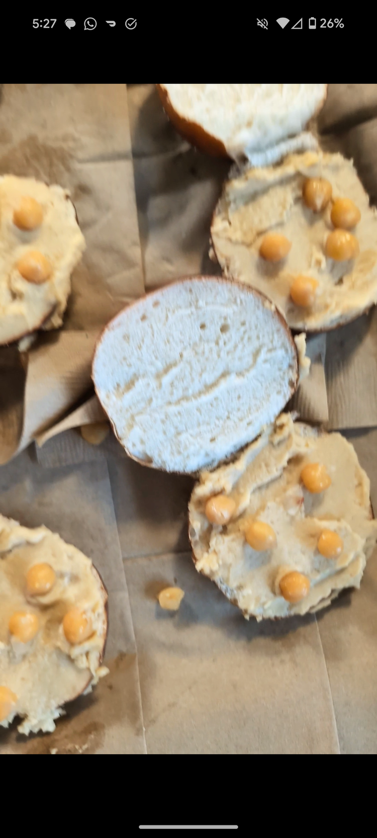 Image of Smear buns with hummus (and warm in oven), sprinkle with chickpeas.  