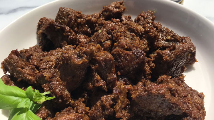 Image of Serve and Enjoy:Garnish your Beef Rendang with fresh cilantro and...