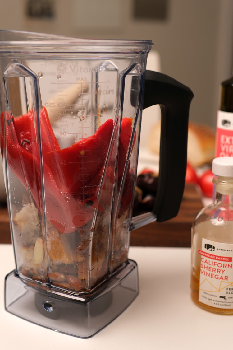 Image of Add all the ingredients except the olive oil to a high-powered blender or food processor