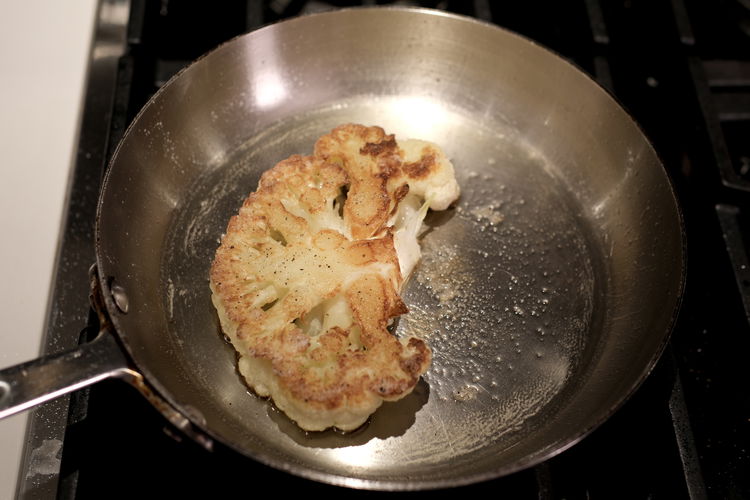 Image of Add olive oil to a hot stove top pan at...