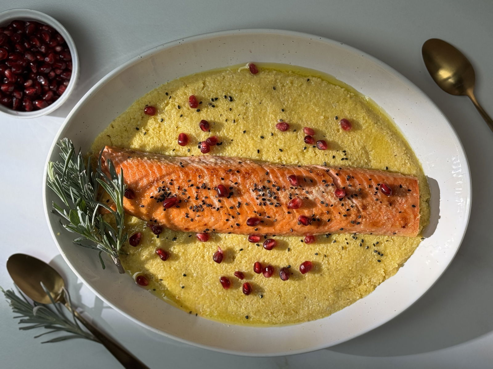 Image of Maple Garlic Steelhead on Polenta with Pomegranate Garnish