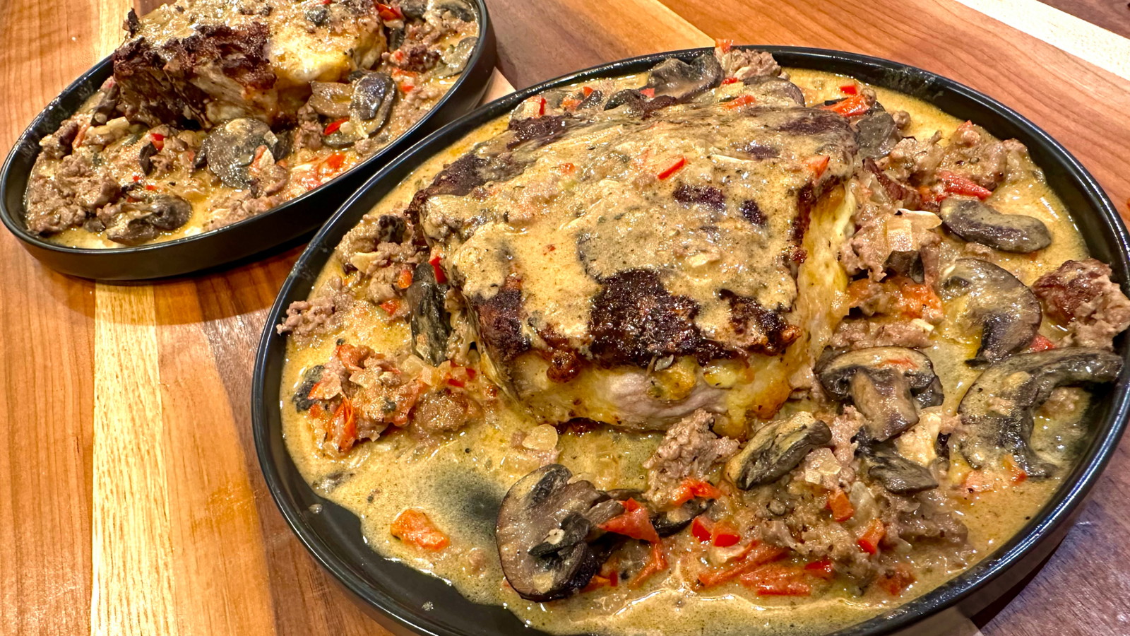 Image of Cast Iron Porterhouse Pork Chops with Creamy Garlic Mushroom Sauce