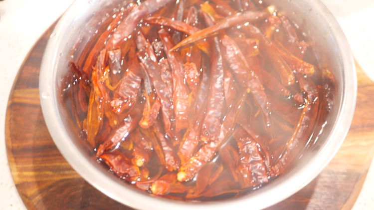 Image of Wash and soak in hot water for 20 minutes 