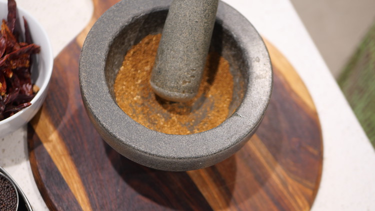 Image of Once chillies are drained. Add them to the food processor alongside, garlic, grounded spices salt and olive oil. 