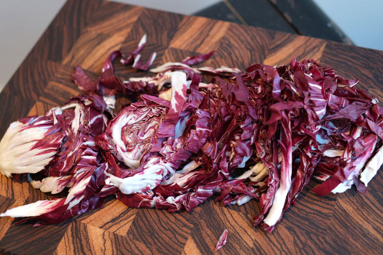 Image of Remove and toss the small lower core of the radicchio...