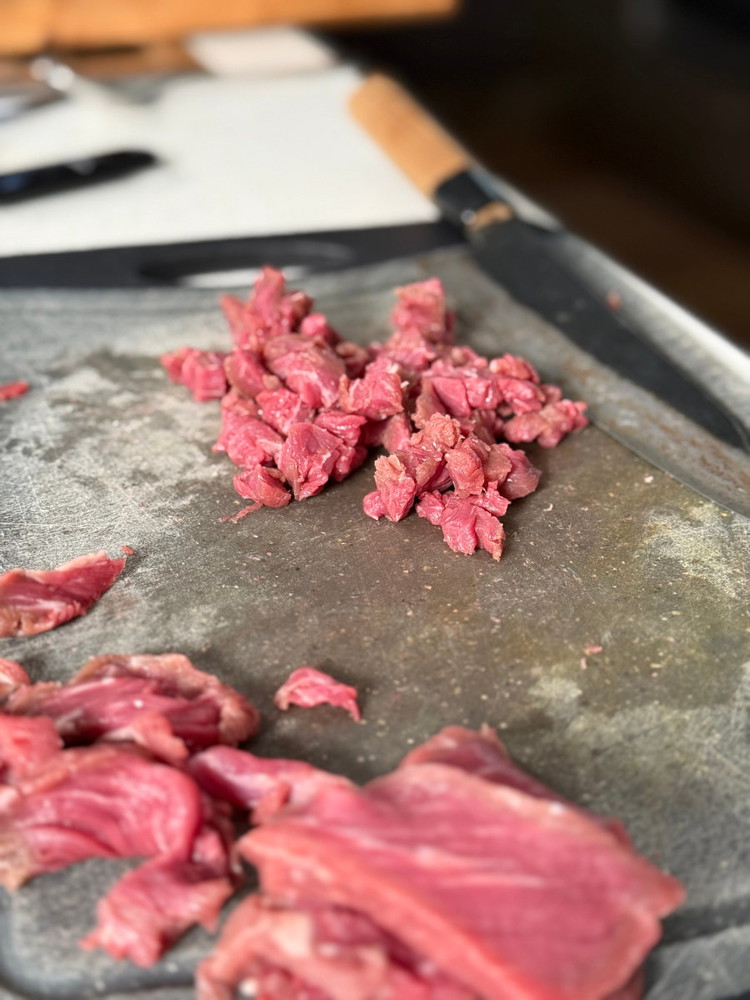 Image of Slice your chilled beef eye fillet into small dices approximately 0.5cm in diameter 