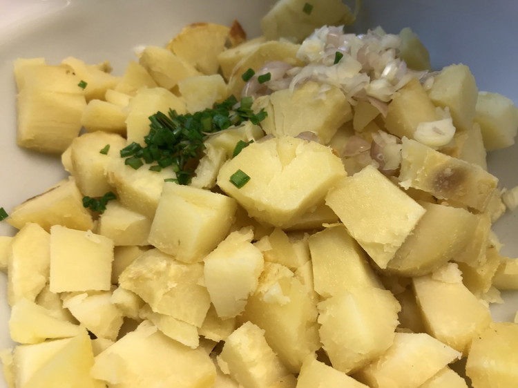 Image of Cut up some chives along with some sweet shallots/sweet onions and add to your potatoes. You don’t need a lot.
