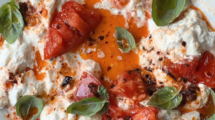 Burratta and chilli oil with lush fresh tomato.