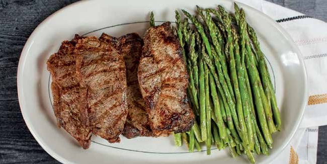 Image of Grilled New York Strip Steaks with Asparagus