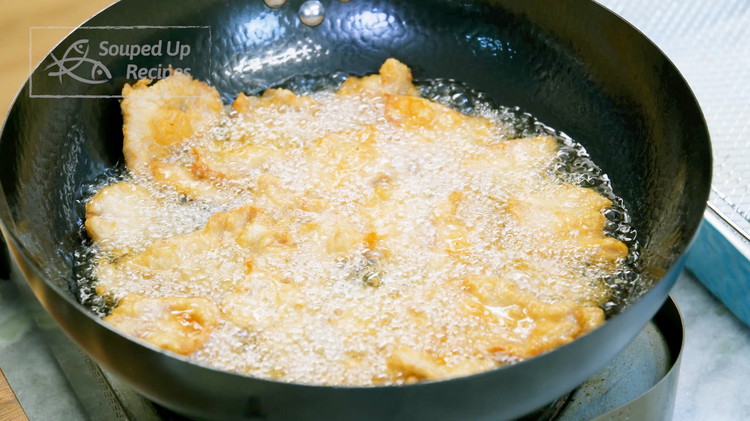 Image of Increase the oil's temperature to 400°F / 204°C. Double-fry the pork over high heat for 1-2 minutes or until golden brown.