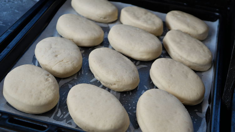 Image of Place shaped dough onto a lightly floured tray and cover...