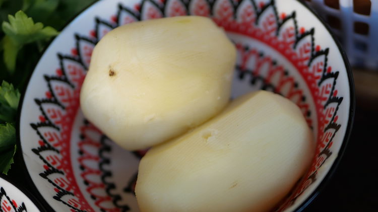 Image of Add peeled and diced potatoes into a saucepan. Fill with...