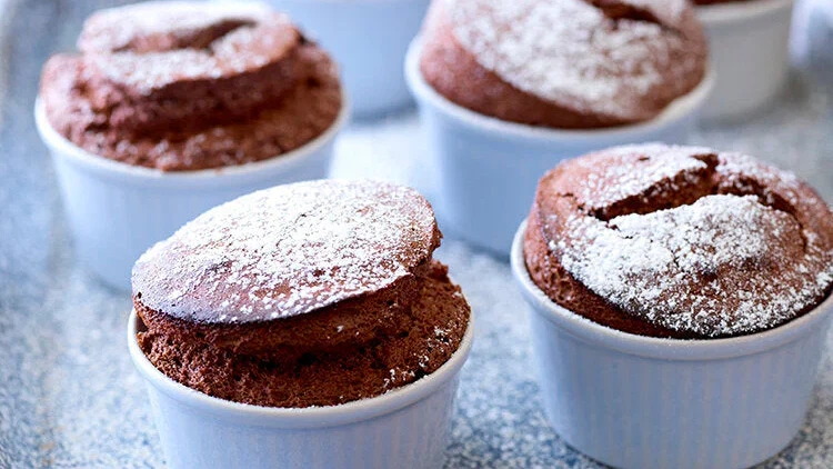 Image of Easy hot chocolate soufflés with chocolate & cardamom sauce