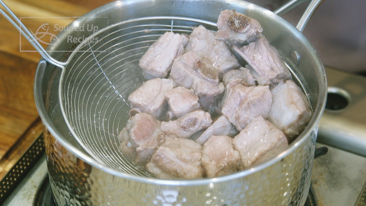 Image of Remove the ribs from the pot and set them aside.