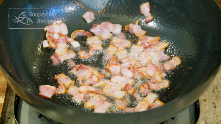 Image of Turn the heat to medium and preheat the wok for 20 seconds. Add the bacon, spread it out, and let it fry. Then stir the bacon for a couple of minutes or until you get about 2-3 Tbsps of fat....