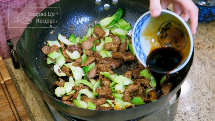 Image of Toss in the bok choy stem and 1 Tbsp of minced garlic. Pour the stir fry sauce from the side of the wok so it can caramelize by the heat. Keep mixing until the bok choy stems are cooked through,...