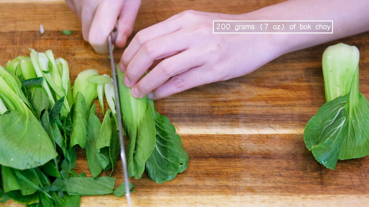 Image of While waiting, wash the bok choy and thinly julienne them lengthwise into strips.