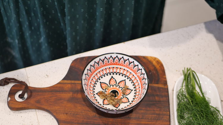 Image of Mash the roasted garlic in a bowl