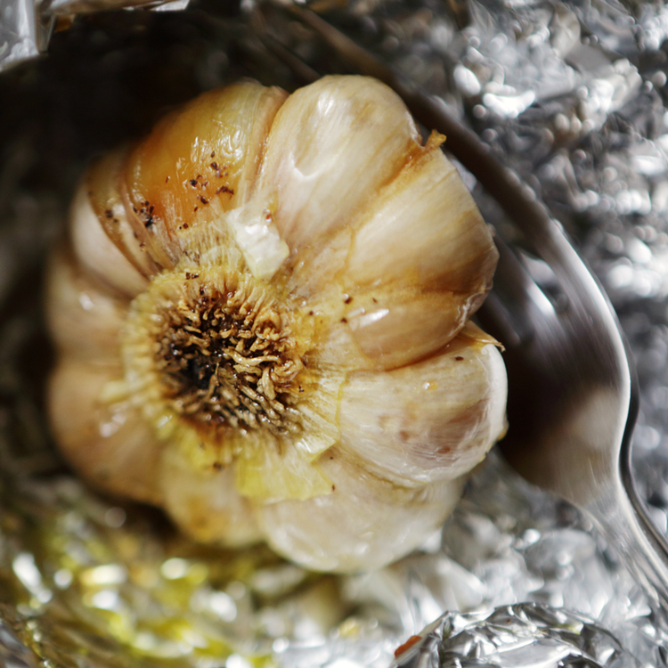 Image of Slice the top off the garlic bulb, drizzle with a...