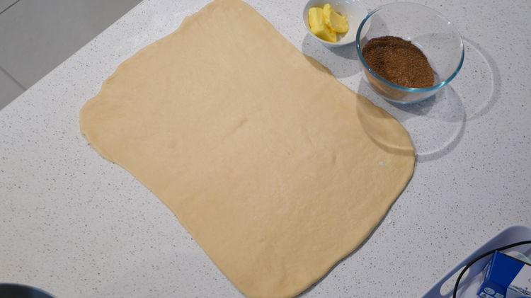 Image of Roll out the dough into a 35.5x22.8-cm / 14x9-inch rectangle...