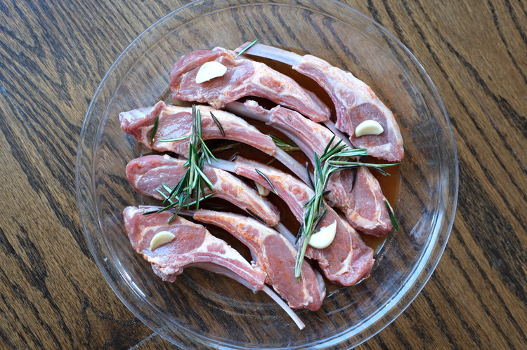 Image of Put half of the garlic and half of the prepared rosemary in the marinade, set lamb chops in marinade in a single layer and place remaining marinade garlic and rosemary on top of lamb.  Cover with clear wrap and refrigerate...